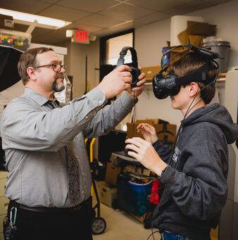 student with VR headset